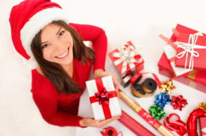 Christmas girl wrapping gifts